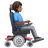 Man In Motorized Wheelchair Facing Right: Medium-Dark Skin Tone