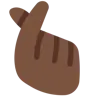 Hand With Index Finger And Thumb Crossed: Dark Skin Tone Emoji 🫰🏿 image - Twitter / X (Twemoji) style