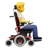 Person In Motorized Wheelchair Facing Right
