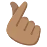 Hand With Index Finger And Thumb Crossed: Medium Skin Tone Emoji 🫰🏽 image - Google Noto Color style