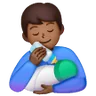 Man Feeding Baby: Medium-Dark Skin Tone Emoji 👨🏾‍🍼 image - Samsung style