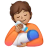 Person Feeding Baby: Medium Skin Tone Emoji 🧑🏽‍🍼 image - Samsung style