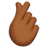 Hand With Index Finger And Thumb Crossed: Medium-Dark Skin Tone Emoji 🫰🏾 image - Apple style
